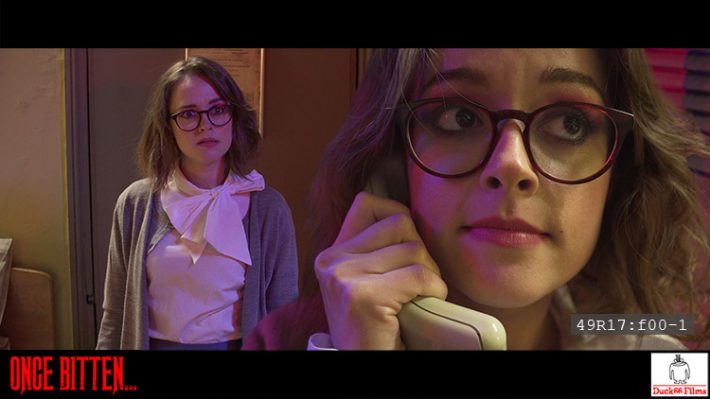 Timecoded frame from Once Bitten... showing both the roles of Martha Swales and Dredvoka being played by Lauren Ashley Carter
