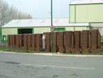 Stack of brown wheelie bins