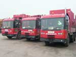 Three red bin lorries