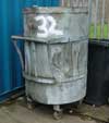 Battered old metal wheelie bin